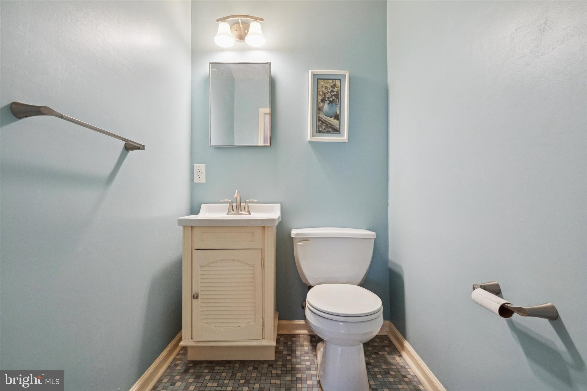 230 South Carol Boulevard, Unit B000 Upper Darby, PA 19082 - Photo 7 of 25 a bathroom with a toilet sink and mirror