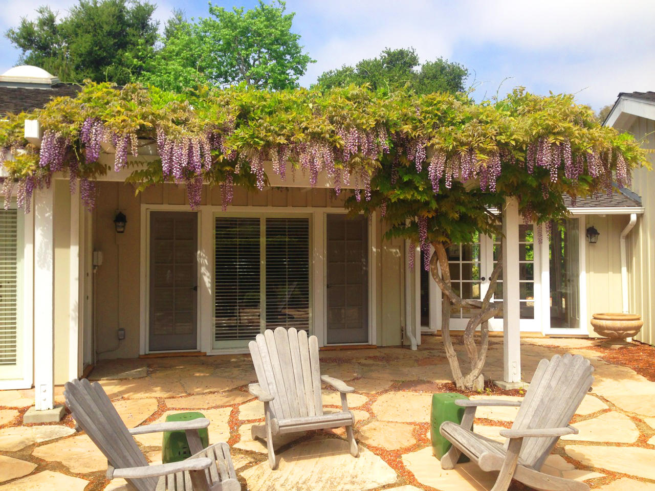 145 La Vereda Road Montecito, CA 93108 - Photo 15 of 17 a view of a patio with table and chairs near a barbeque