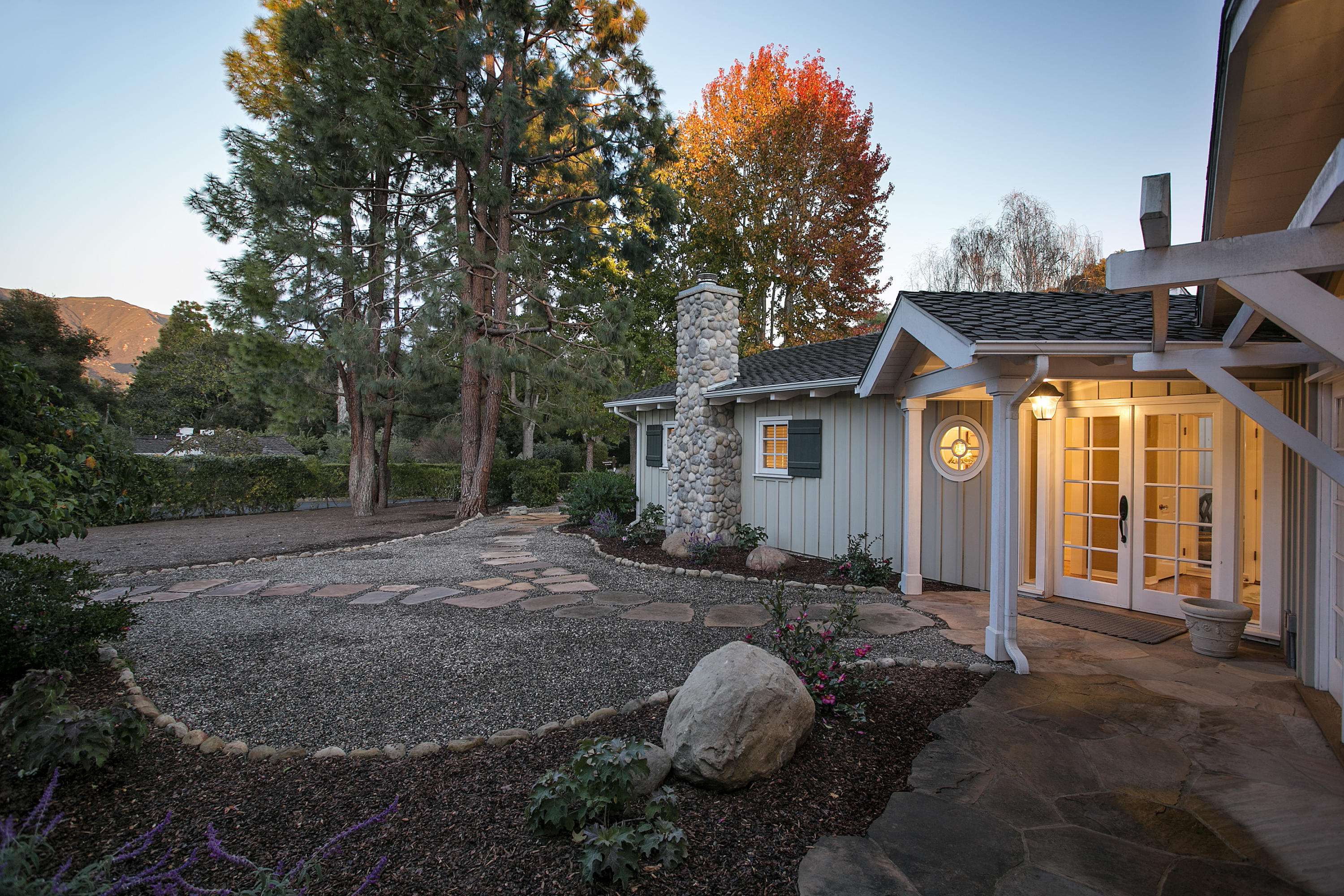 145 La Vereda Road Montecito, CA 93108 - Photo 3 of 17 a view of a house with backyard and trees