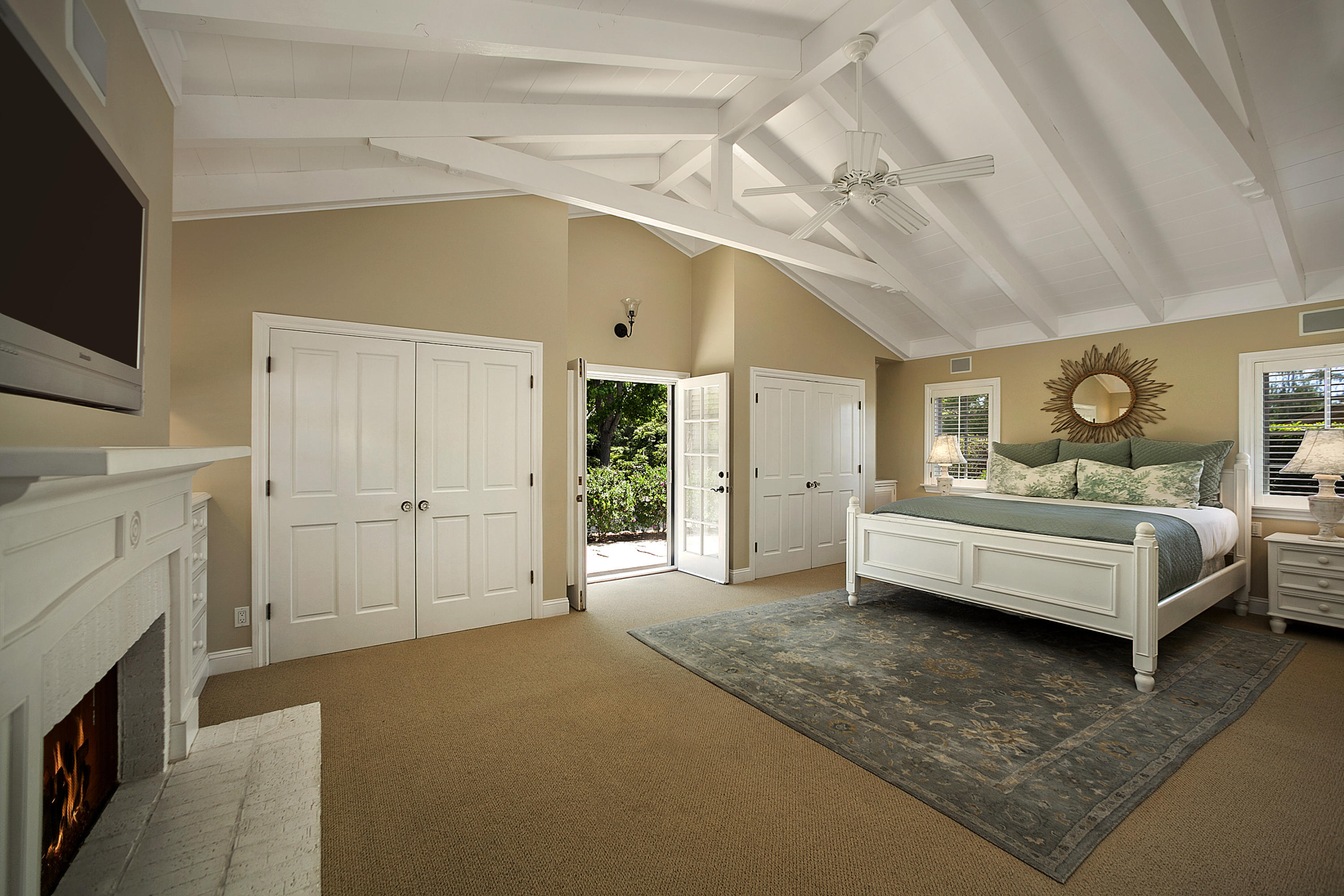 145 La Vereda Road Montecito, CA 93108 - Photo 9 of 17 a bedroom with furniture and a flat screen tv