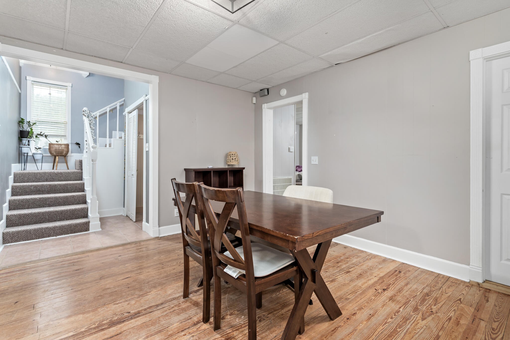 7230 Bythewood Road Beaumont, TX 77713 - Photo 15 of 35 a view of a dining room with furniture and wooden floor