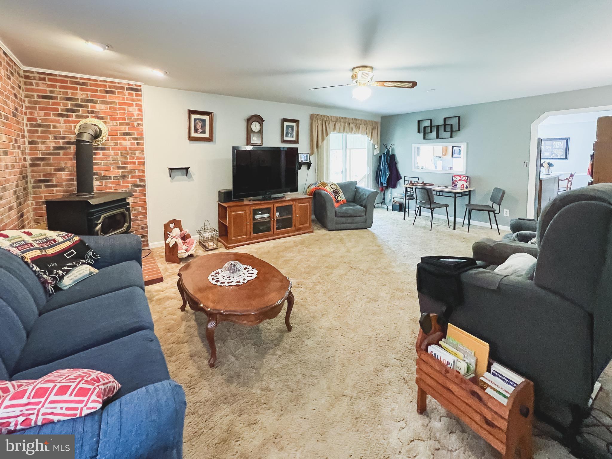 890 Carson Road Huntingtown, MD 20639 - Photo 12 of 64 a living room with furniture and a flat screen tv