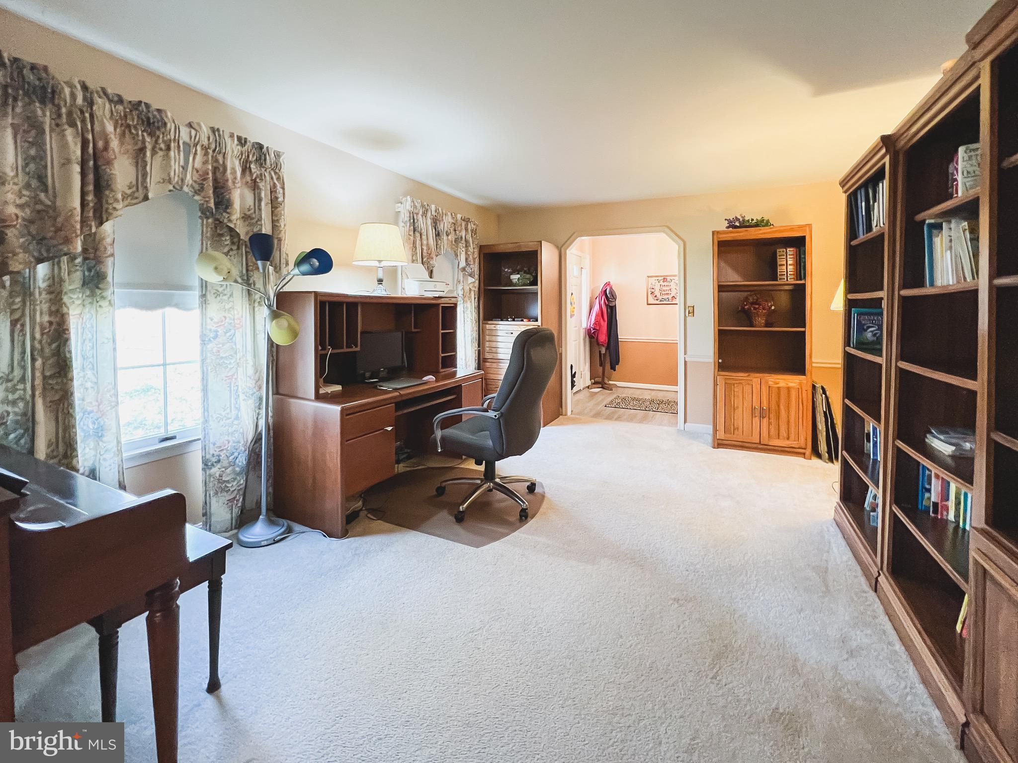 890 Carson Road Huntingtown, MD 20639 - Photo 16 of 64 a view of a livingroom with furniture and a large window