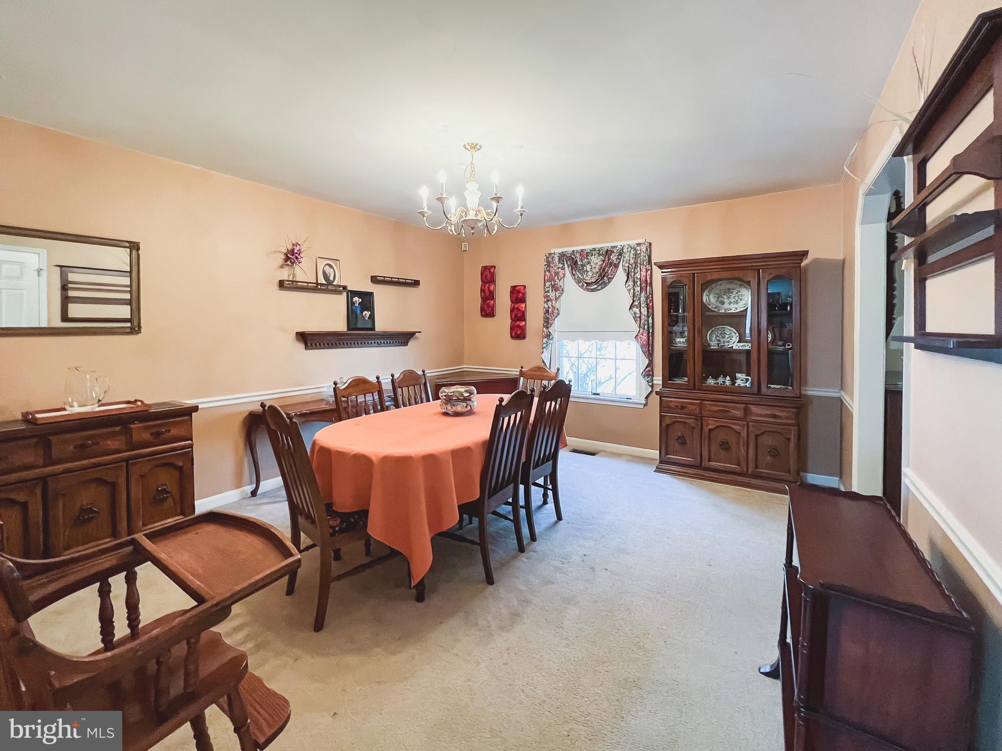 890 Carson Road Huntingtown, MD 20639 - Photo 17 of 64 a view of a dining room with furniture