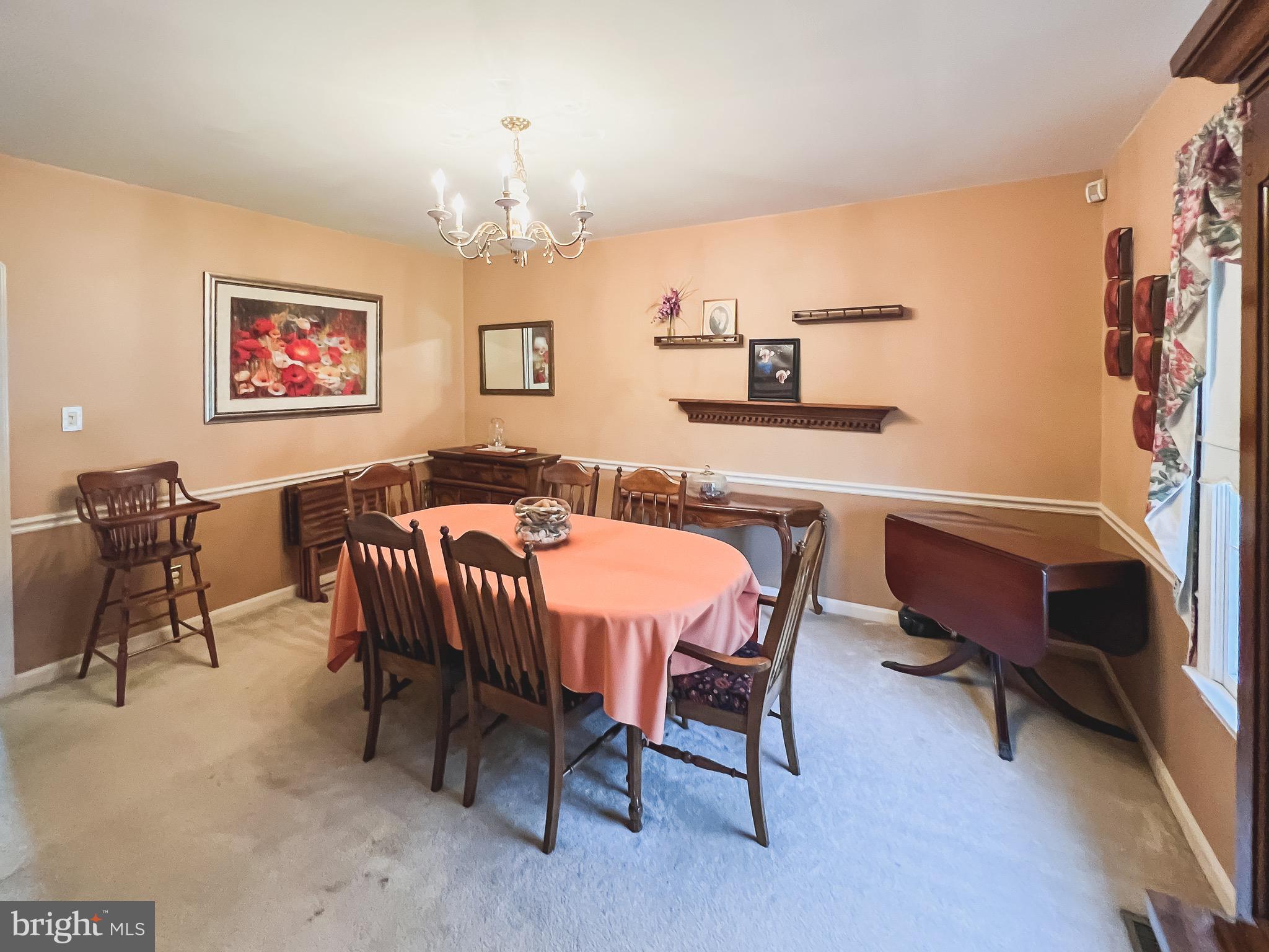 890 Carson Road Huntingtown, MD 20639 - Photo 18 of 64 a dining room with furniture and window