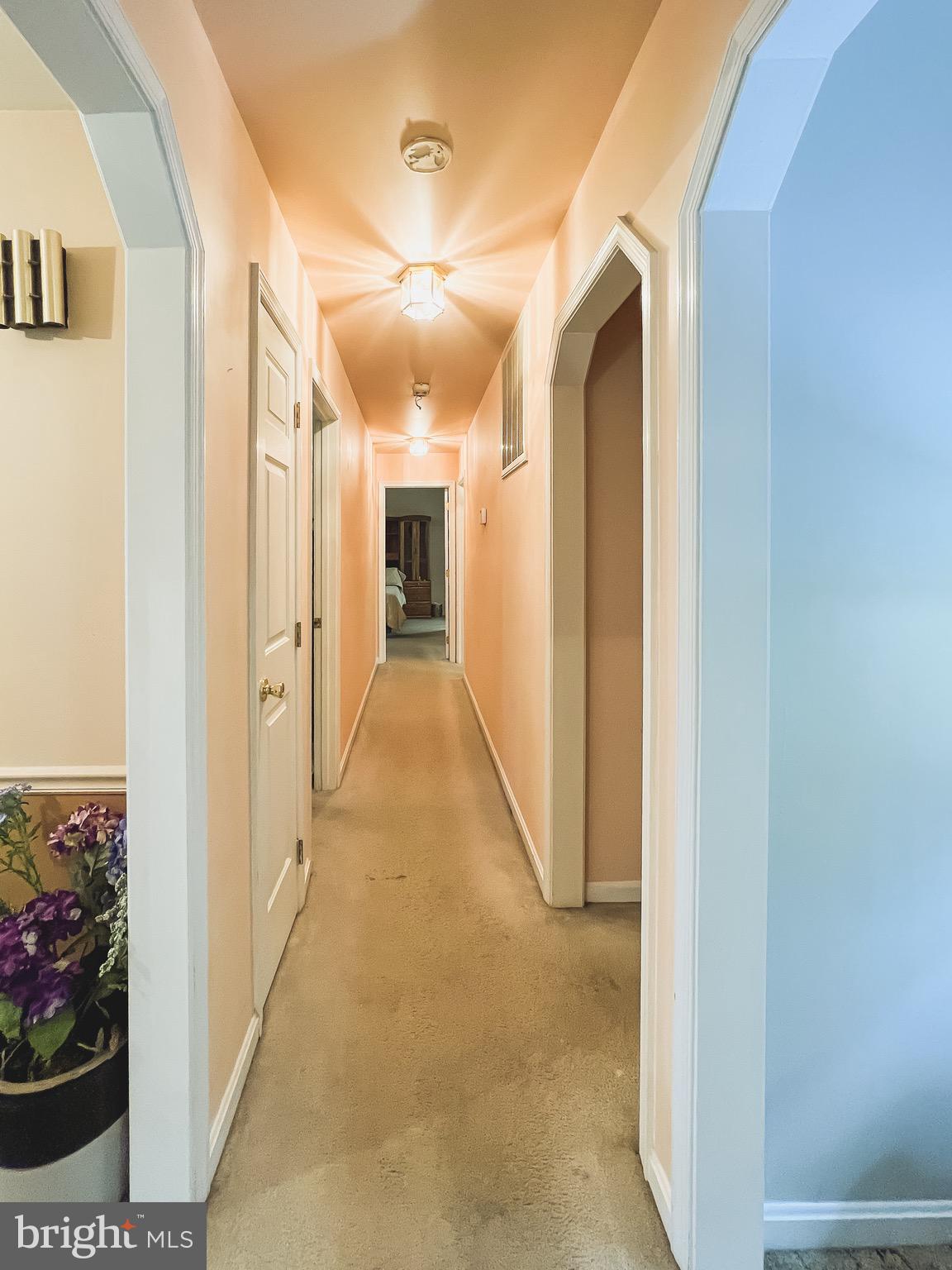 890 Carson Road Huntingtown, MD 20639 - Photo 19 of 64 a view of a hallway with wooden floor and staircase