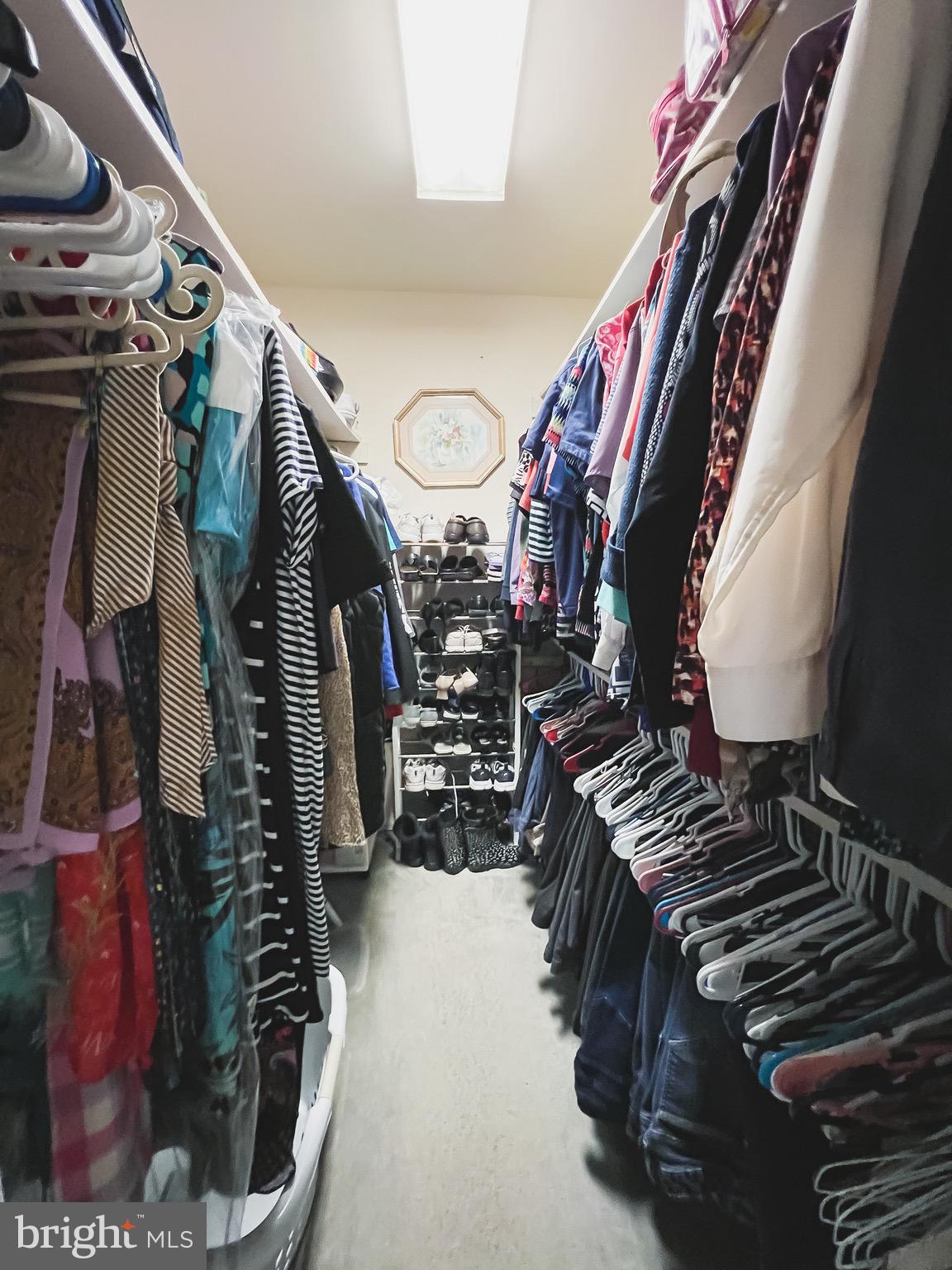 890 Carson Road Huntingtown, MD 20639 - Photo 22 of 64 a view of walk in closet with clothes and shoes