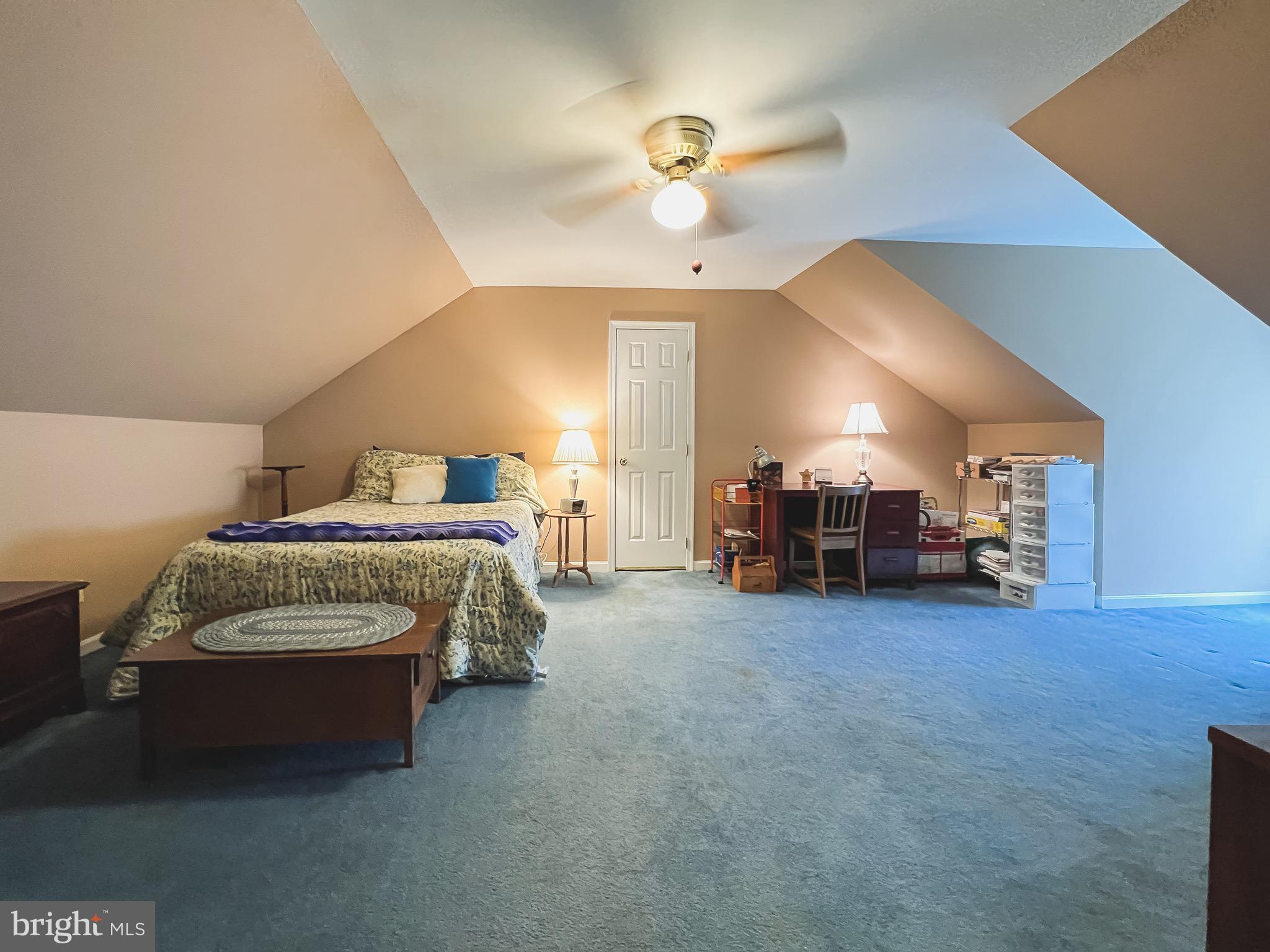 890 Carson Road Huntingtown, MD 20639 - Photo 40 of 64 a bedroom with a bed and a chandelier