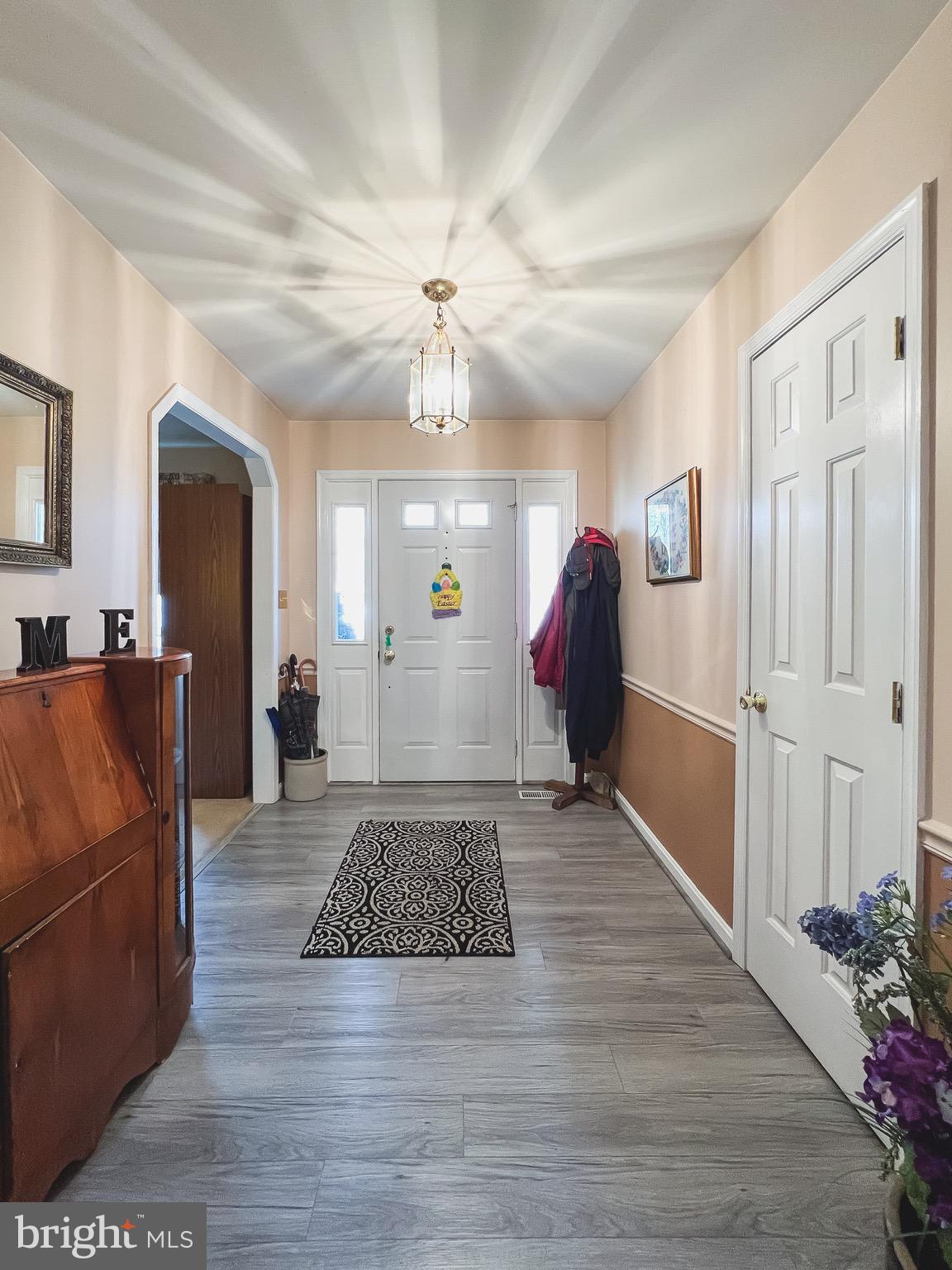 890 Carson Road Huntingtown, MD 20639 - Photo 4 of 64 a living room with furniture and wooden floor
