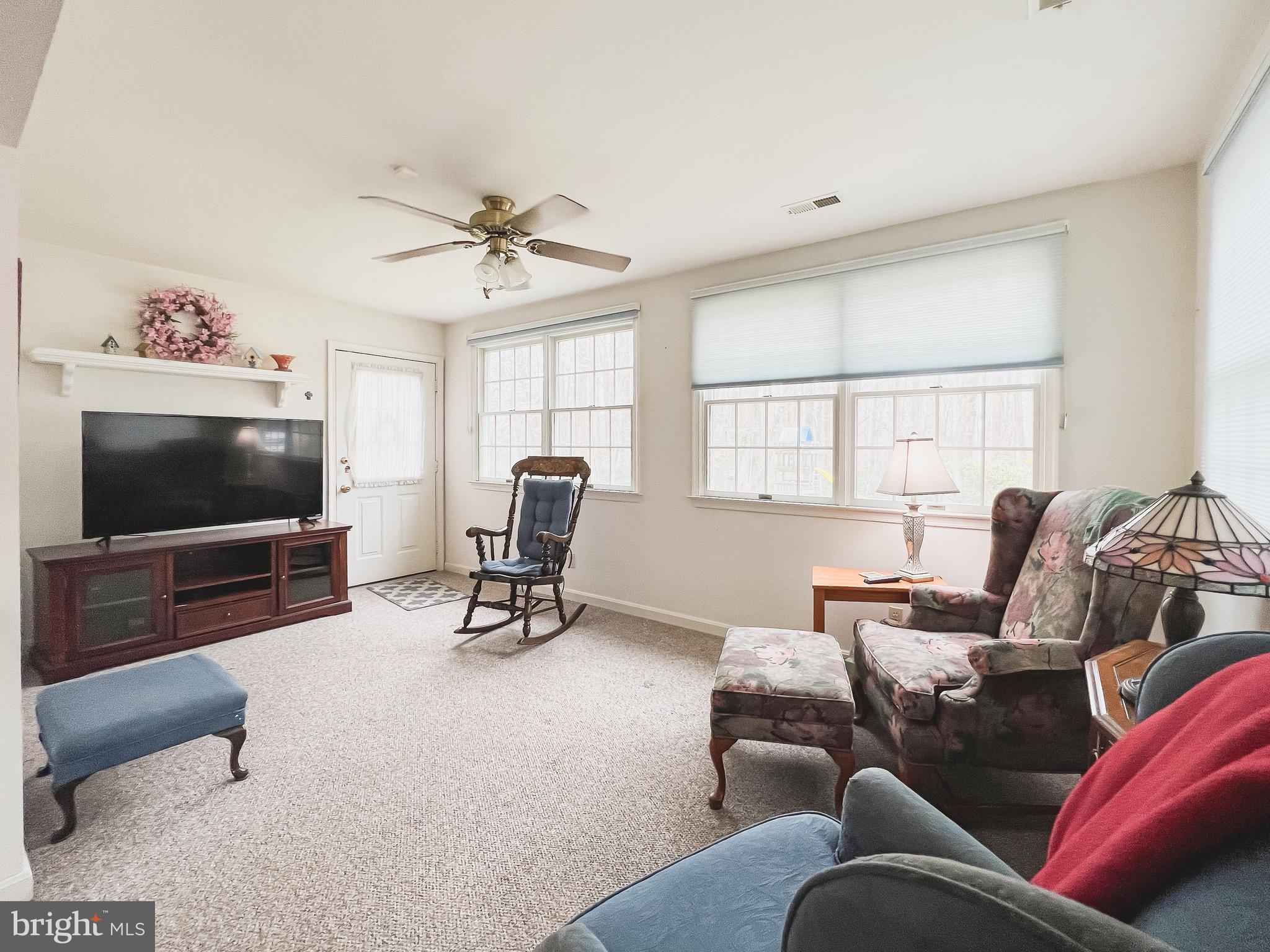 890 Carson Road Huntingtown, MD 20639 - Photo 44 of 64 a living room with furniture and a flat screen tv