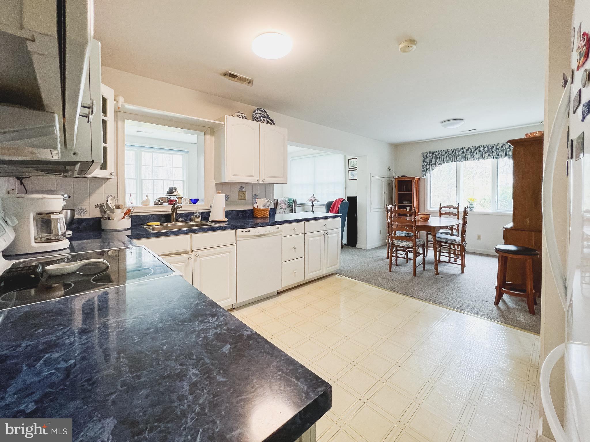 890 Carson Road Huntingtown, MD 20639 - Photo 46 of 64 a kitchen with lots of counter top space and wooden floor