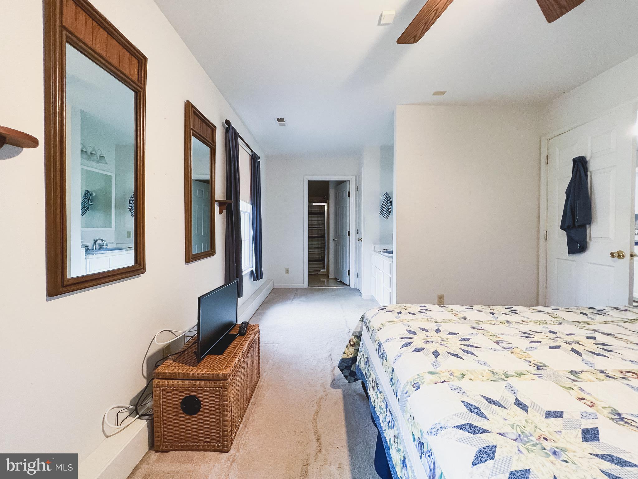 890 Carson Road Huntingtown, MD 20639 - Photo 50 of 64 a bedroom with a bed and walk in closet