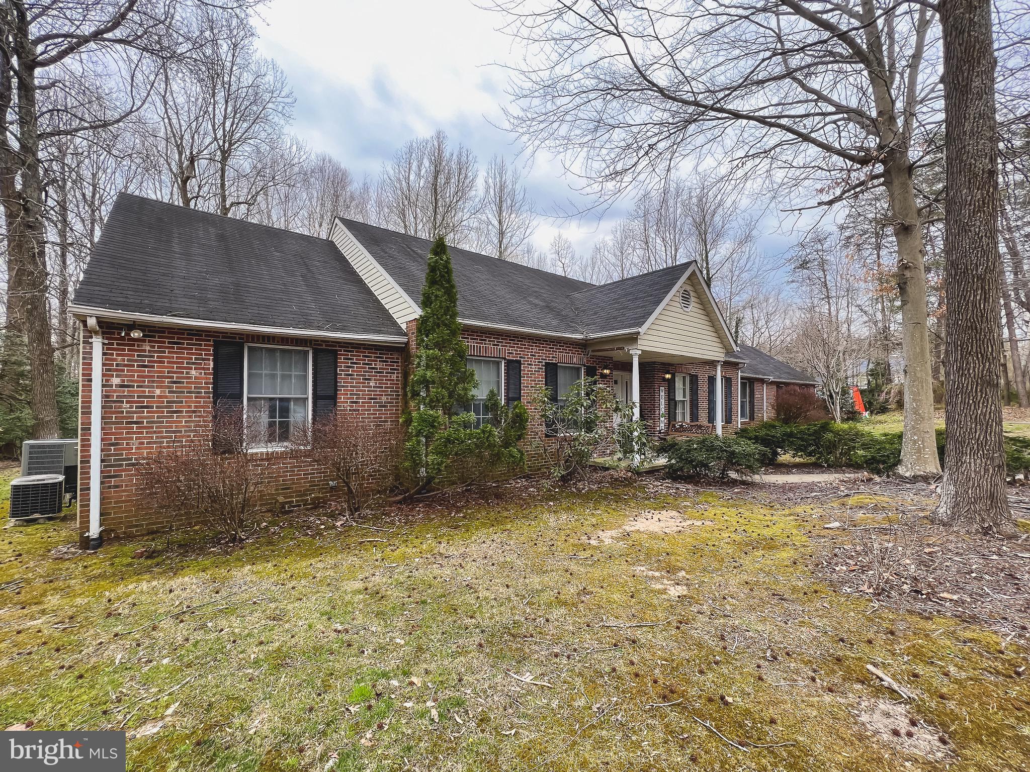 890 Carson Road Huntingtown, MD 20639 - Photo 56 of 64 a front view of a house with garden