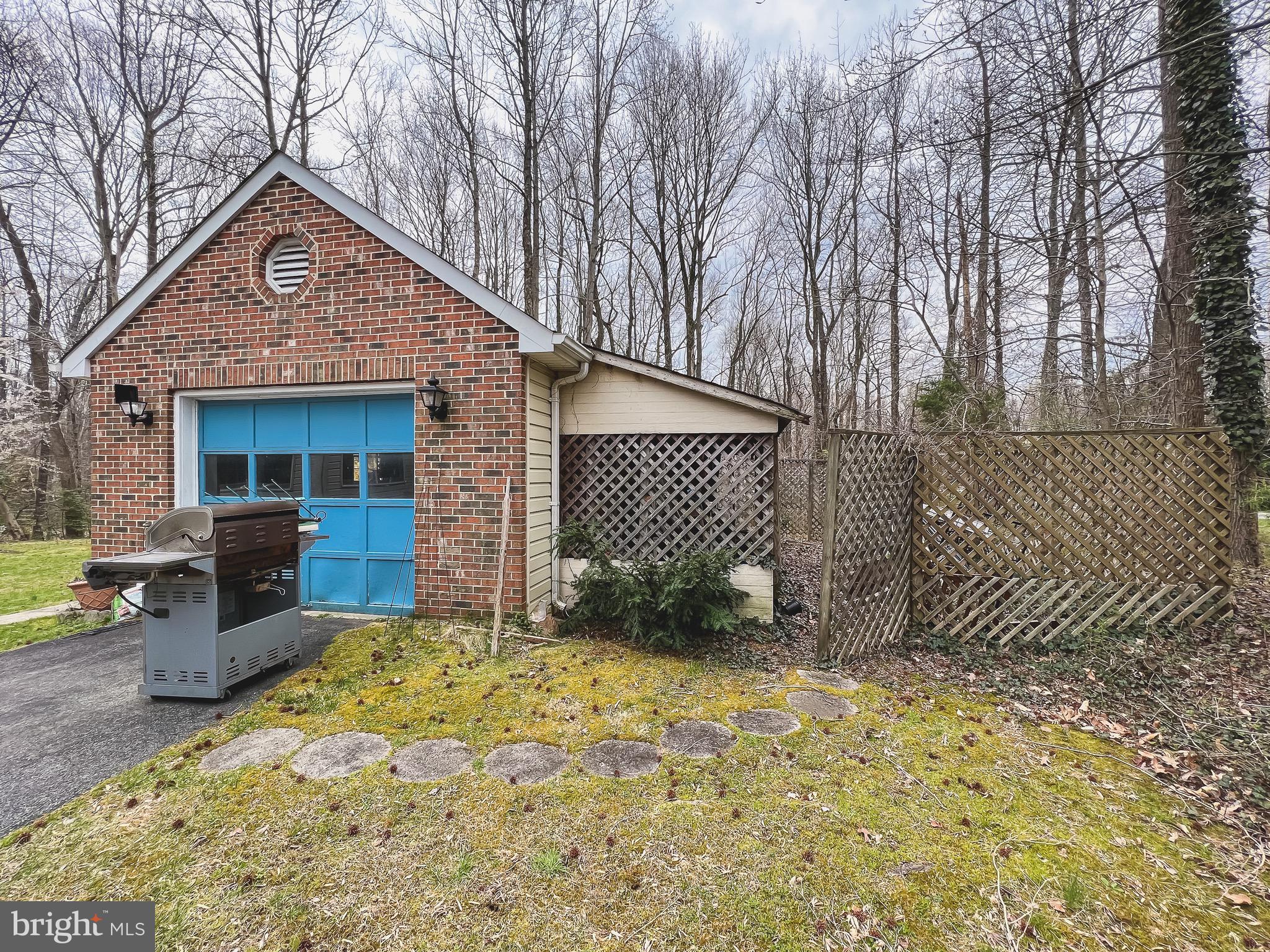 890 Carson Road Huntingtown, MD 20639 - Photo 58 of 64 a front view of a house with a yard