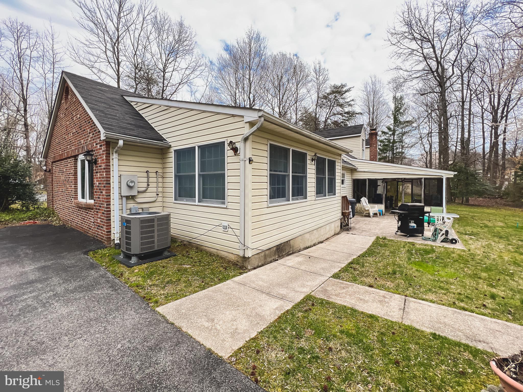890 Carson Road Huntingtown, MD 20639 - Photo 61 of 64 a view of a house with backyard and sitting area