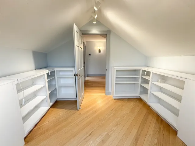 a view of a room with wooden floor and staircase