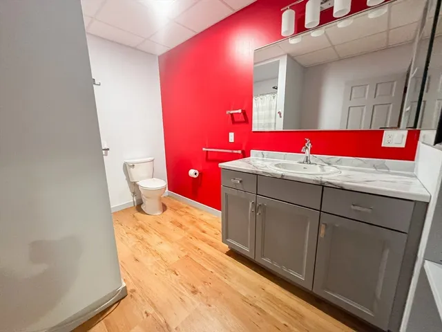 a bathroom with a sink vanity and mirror