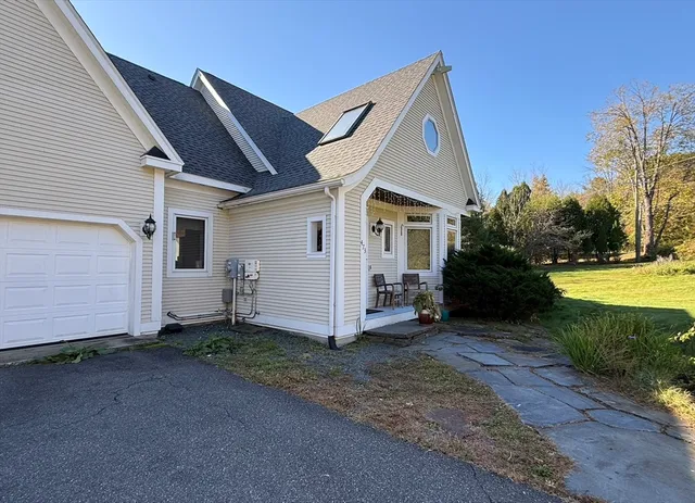 a view of a house with backyard