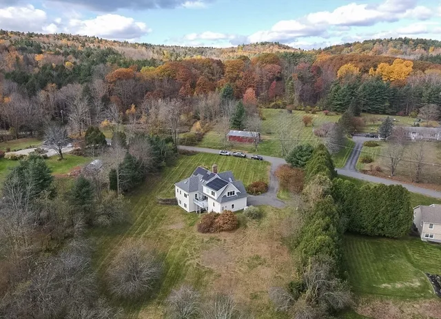 an aerial view of a house with a garden