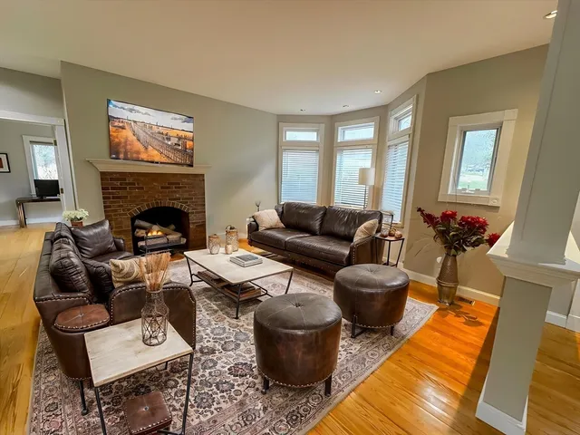 a living room with furniture and a fireplace