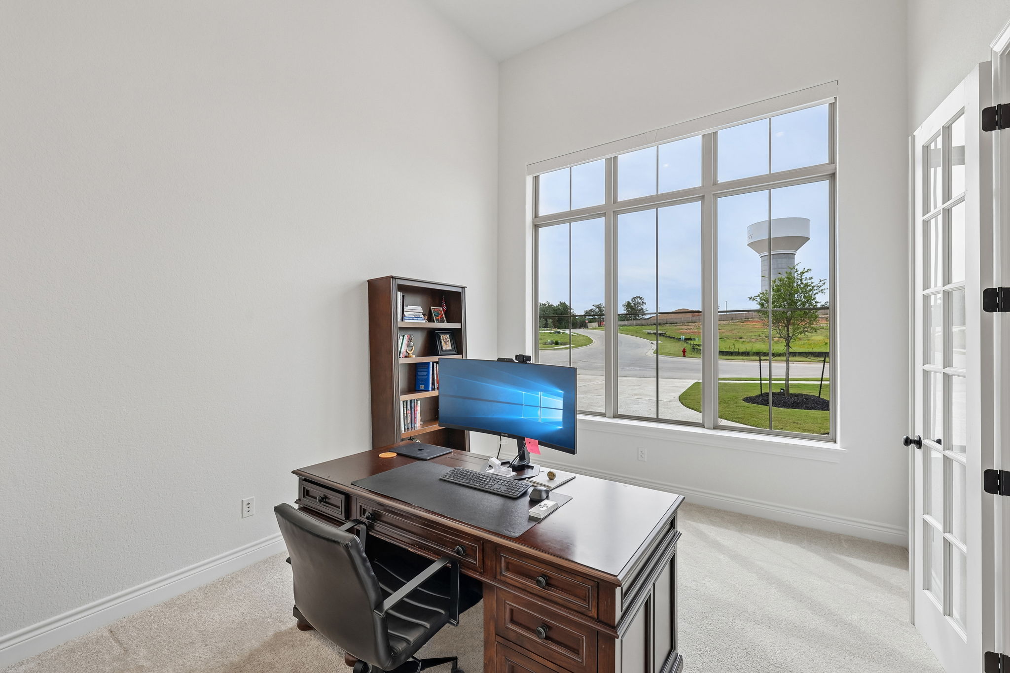 130 Firethorn Loop Bastrop, TX 78602 - Photo 6 of 38 Room with high ceilings and light-toned carpet