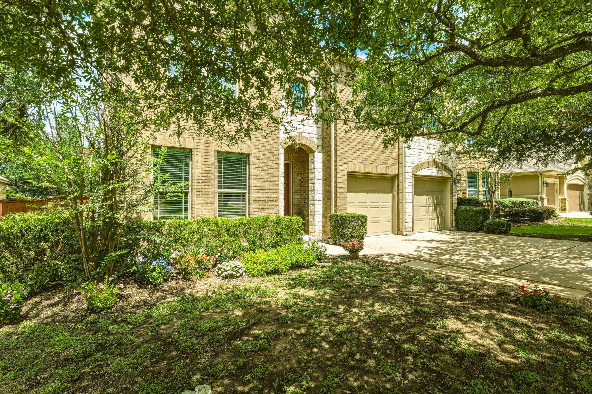 110 Dasher Drive Cedar Park, TX 78613 - Photo 5 of 39 Mature trees shade this brick residence with a neatly manicured front yard and an inviting entry.