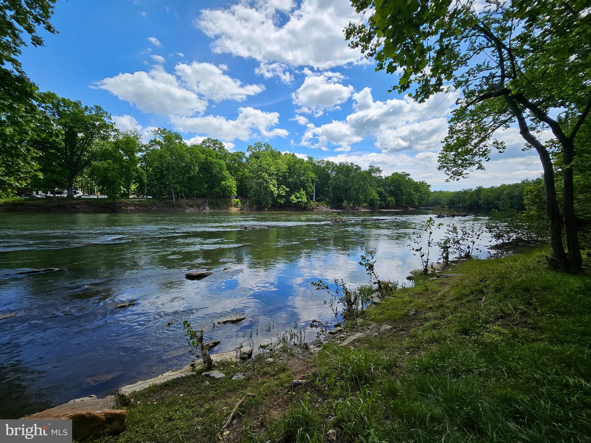 a view of a lake with houses in the back