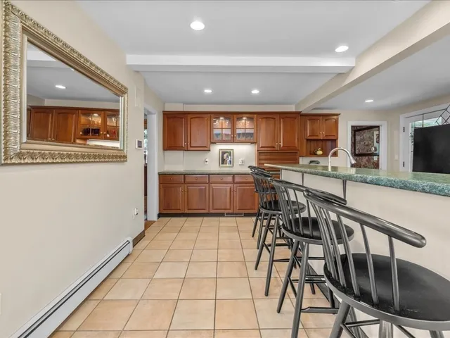 a living room with furniture and floor to ceiling windows