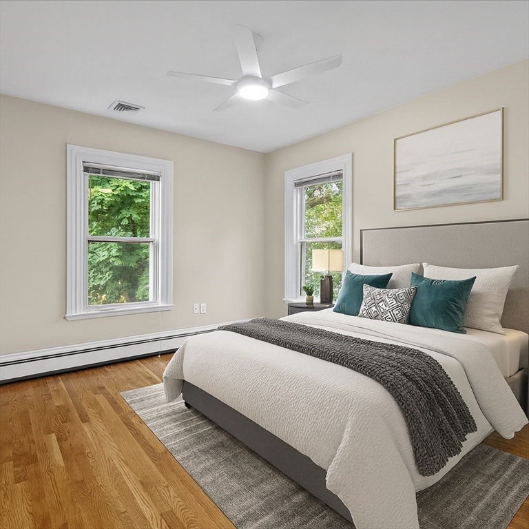 55 Dwight Street Dedham, MA 02026 - Photo 22 of 41 a bedroom with a large bed and a window