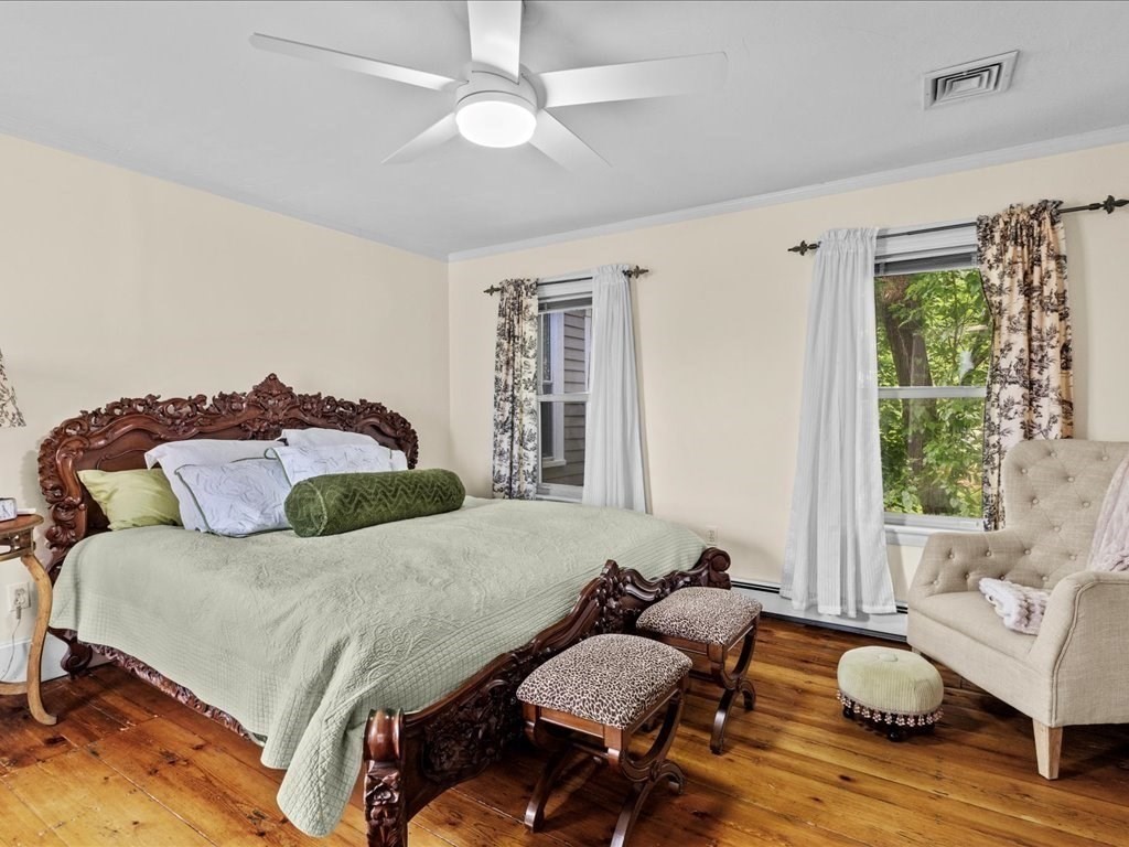 55 Dwight Street Dedham, MA 02026 - Photo 26 of 41 a bedroom with a bed and wooden floor