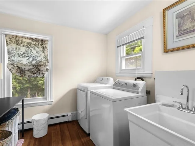 a view of a chairs and table in the balcony