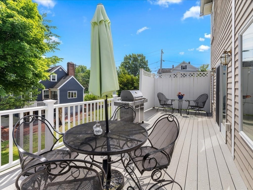 55 Dwight Street Dedham, MA 02026 - Photo 33 of 41 a view of a chairs and table in the balcony