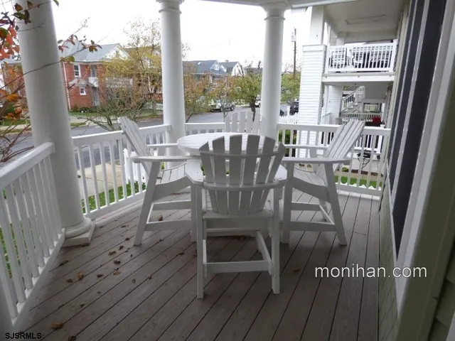 a view of a balcony with chairs
