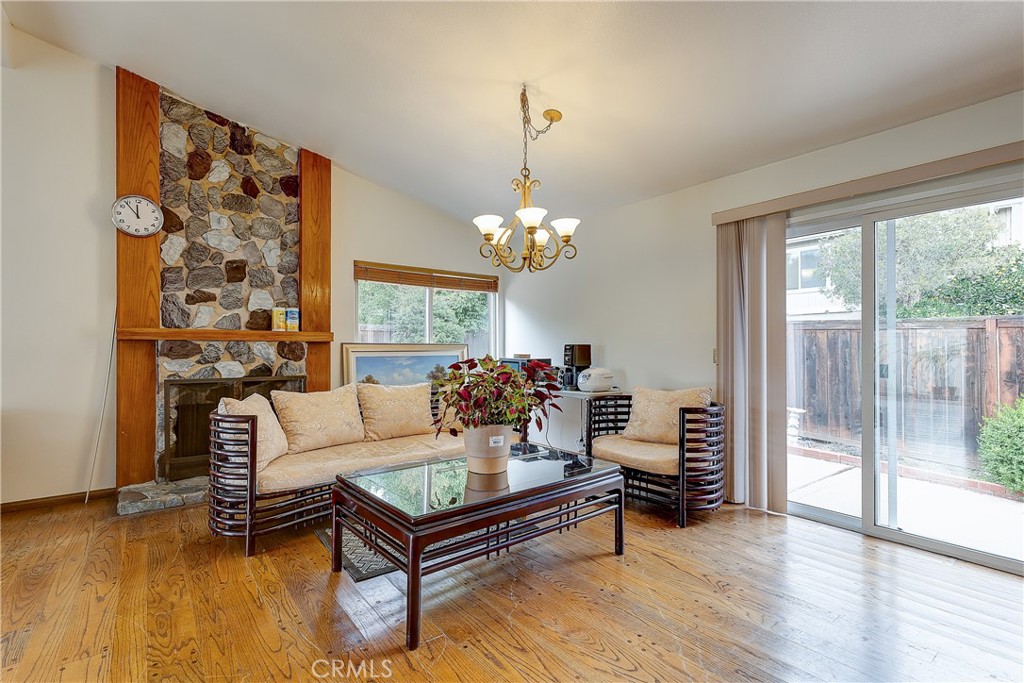 32 Blazing Star Irvine, CA 92604 - Photo 4 of 21 a living room with furniture and a chandelier