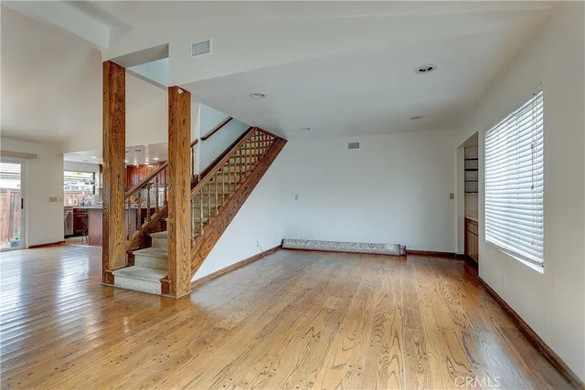 a view of an entryway with wooden floor