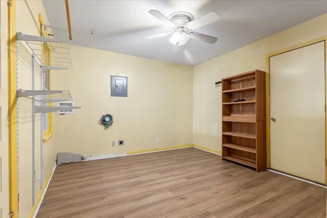 a view of room with windows and lounge chair