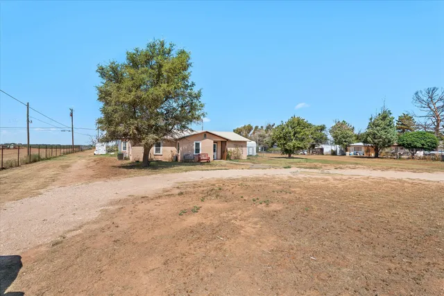 a view of house with outdoor space