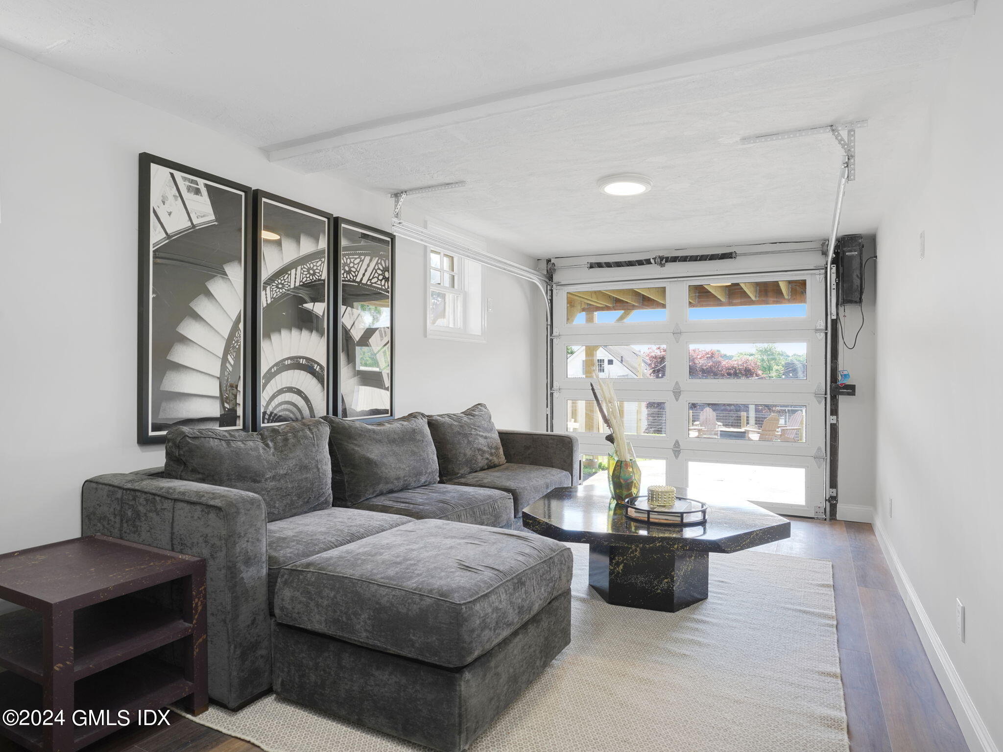 108 Henry Street Greenwich, CT 06830 - Photo 12 of 20 a living room with furniture and a large window