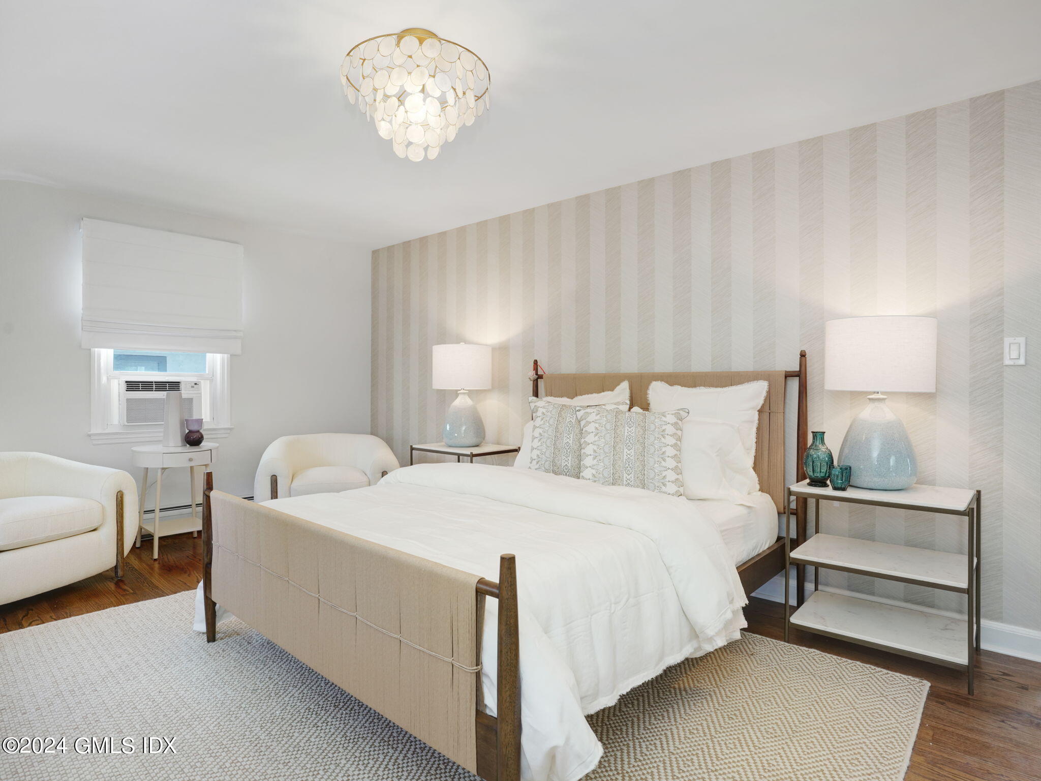 108 Henry Street Greenwich, CT 06830 - Photo 15 of 20 a bedroom with bed and a window