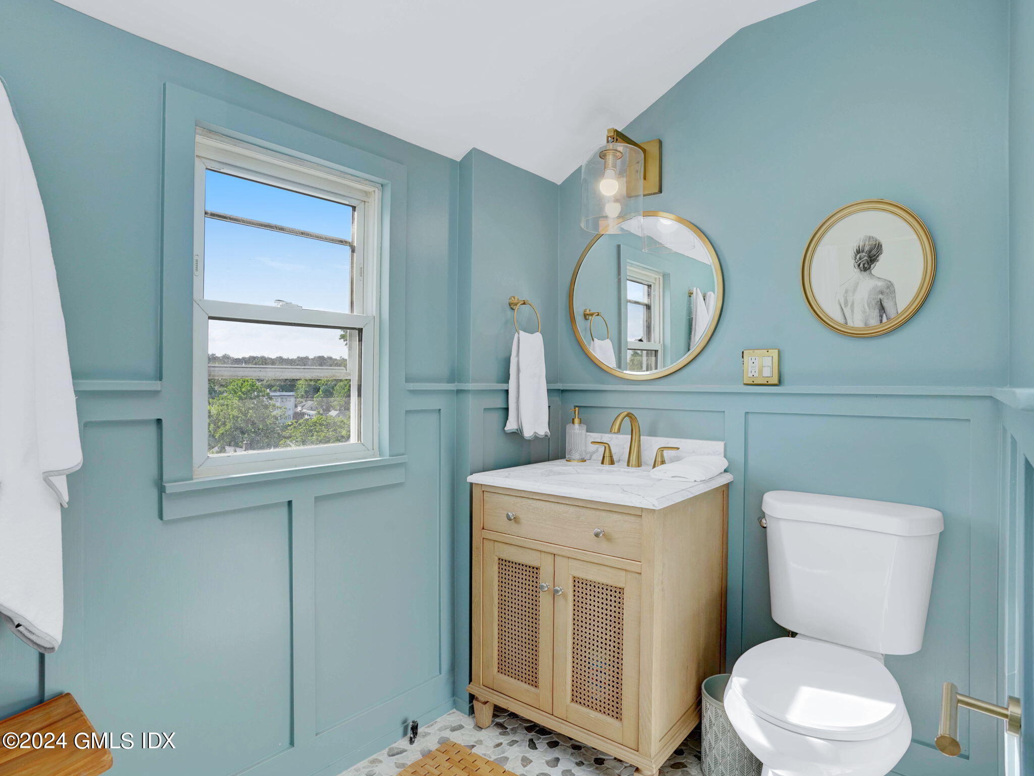 108 Henry Street Greenwich, CT 06830 - Photo 17 of 20 a bathroom with a toilet a sink and a mirror