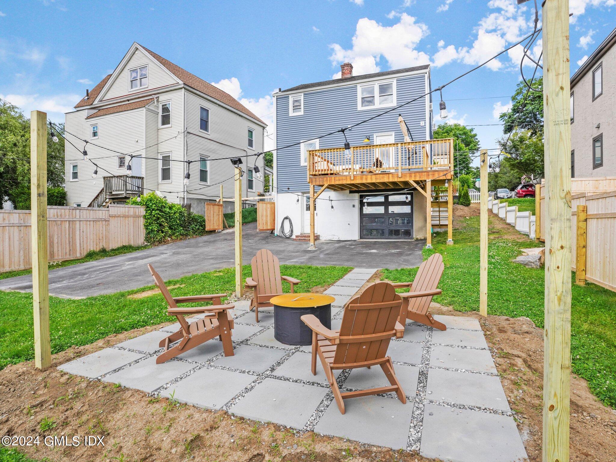 108 Henry Street Greenwich, CT 06830 - Photo 3 of 20 a view of a chairs with a backyard