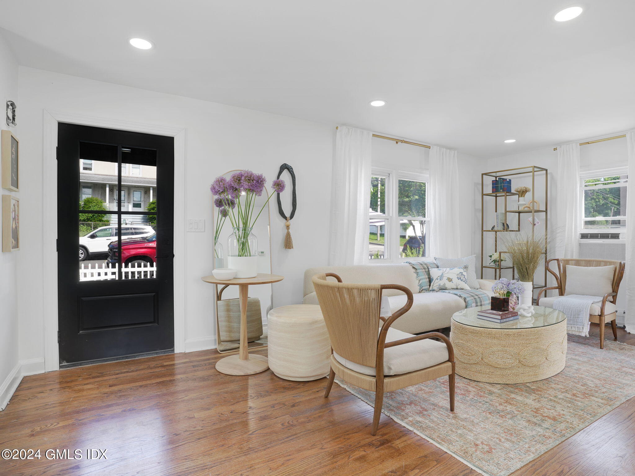 108 Henry Street Greenwich, CT 06830 - Photo 4 of 20 a living room with furniture and a table