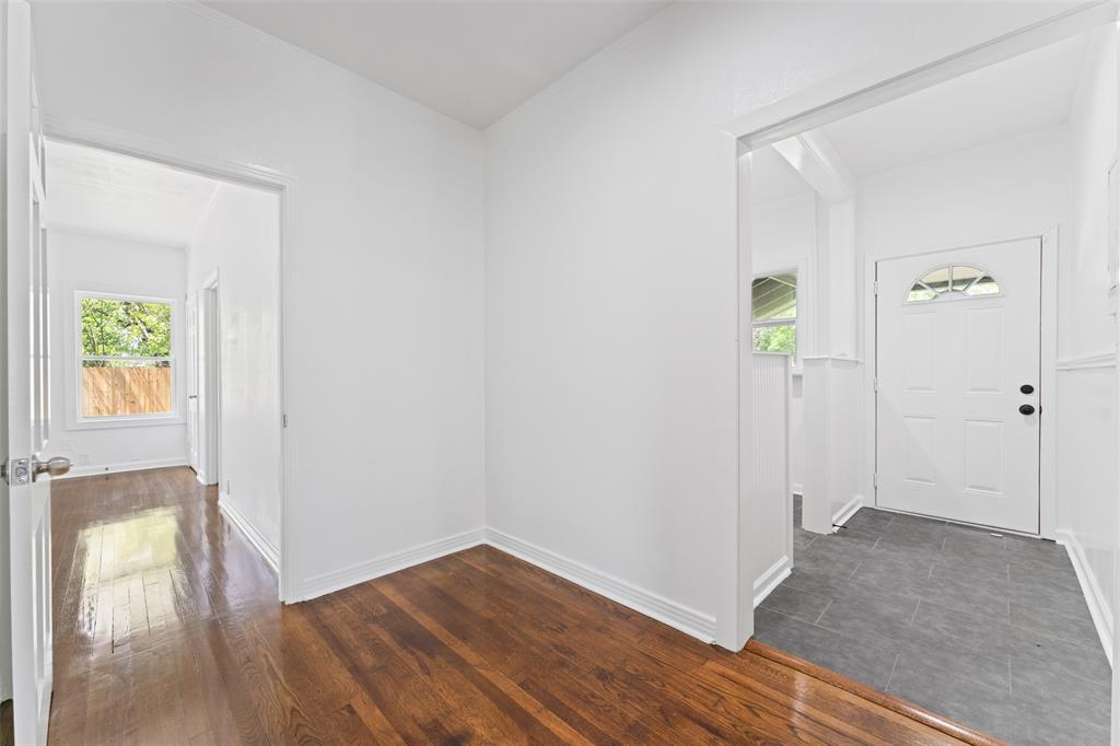 2405 Monroe Street Commerce, TX 75428 - Photo 26 of 31 wooden floor in an empty room
