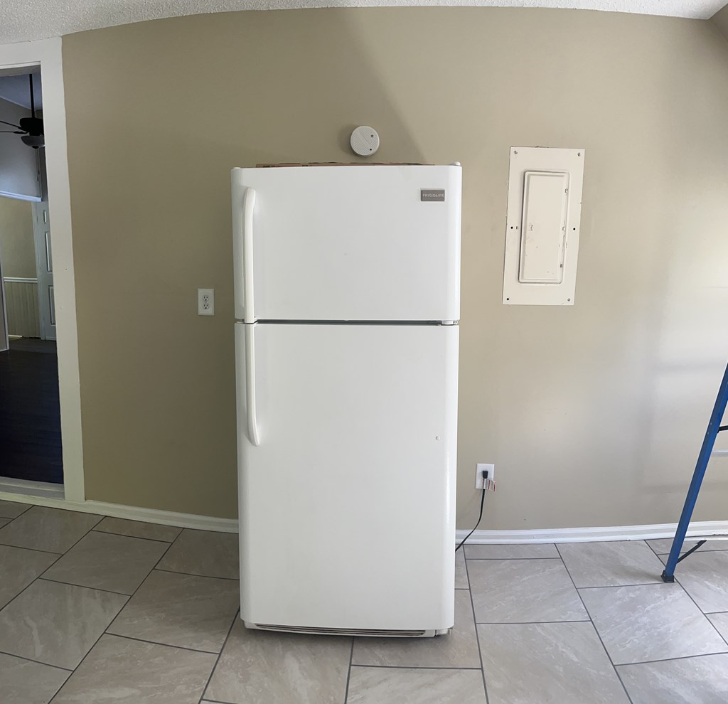 1301 18th Street, Unit B Columbus, GA 31901 - Photo 9 of 18 a view of kitchen with refrigerator and white wall