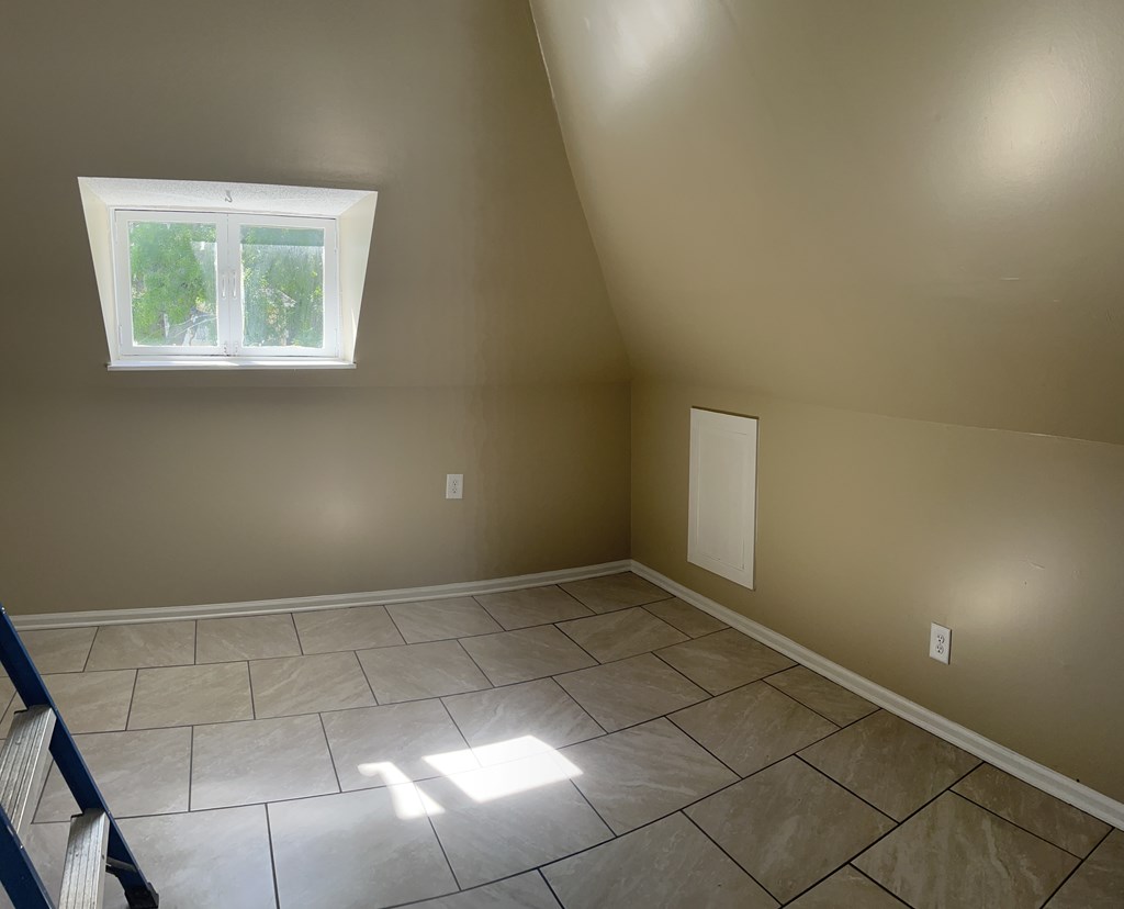 1301 18th Street, Unit B Columbus, GA 31901 - Photo 10 of 18 an empty room with windows