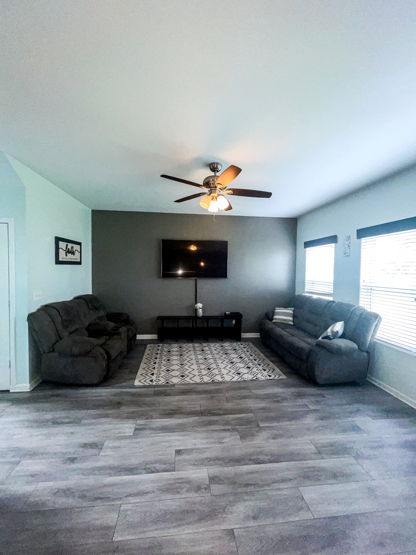 21528 Eich Drive Crest Hill, IL 60403 - Photo 14 of 23 a bedroom with a bed window and couch