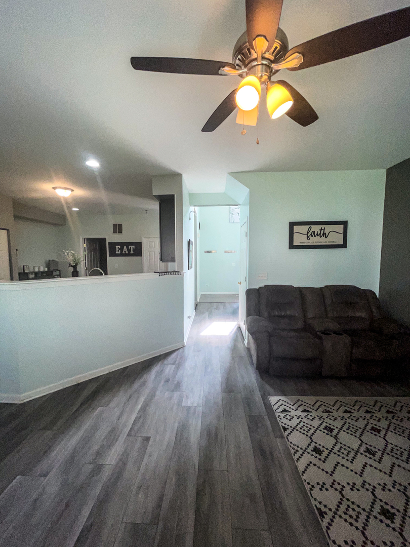 21528 Eich Drive Crest Hill, IL 60403 - Photo 15 of 23 a living room with hard wood flooring and a couch