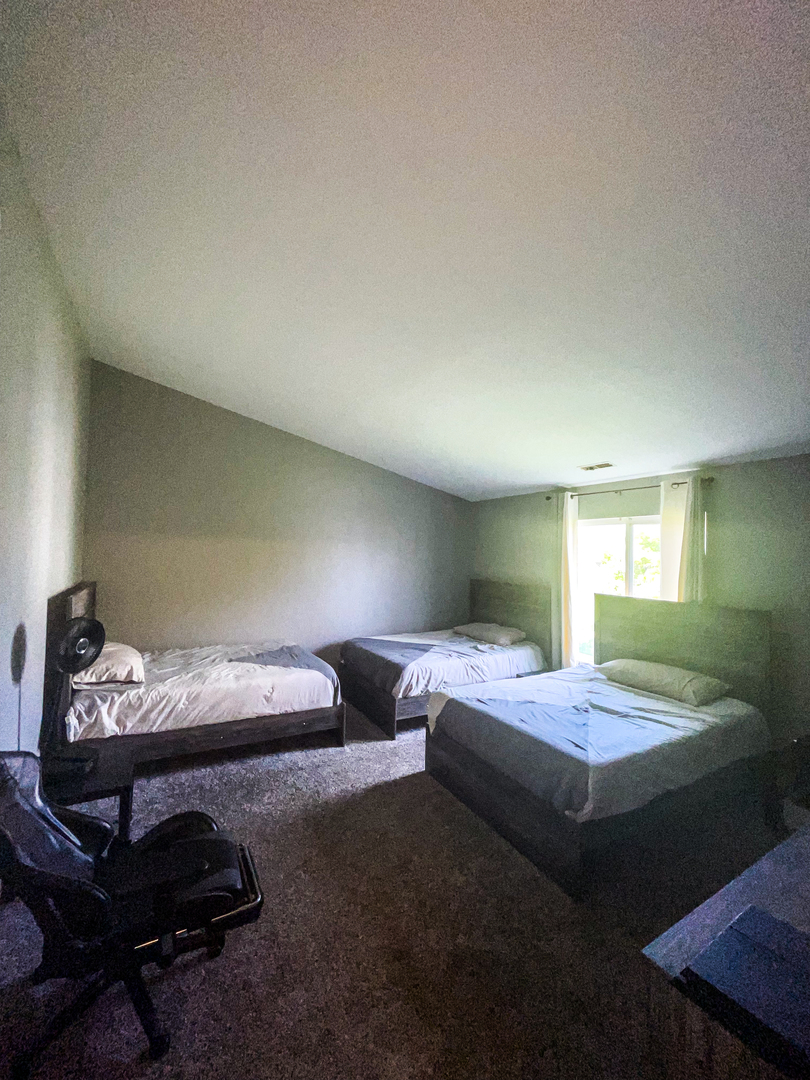 21528 Eich Drive Crest Hill, IL 60403 - Photo 20 of 23 a bedroom with bed and window