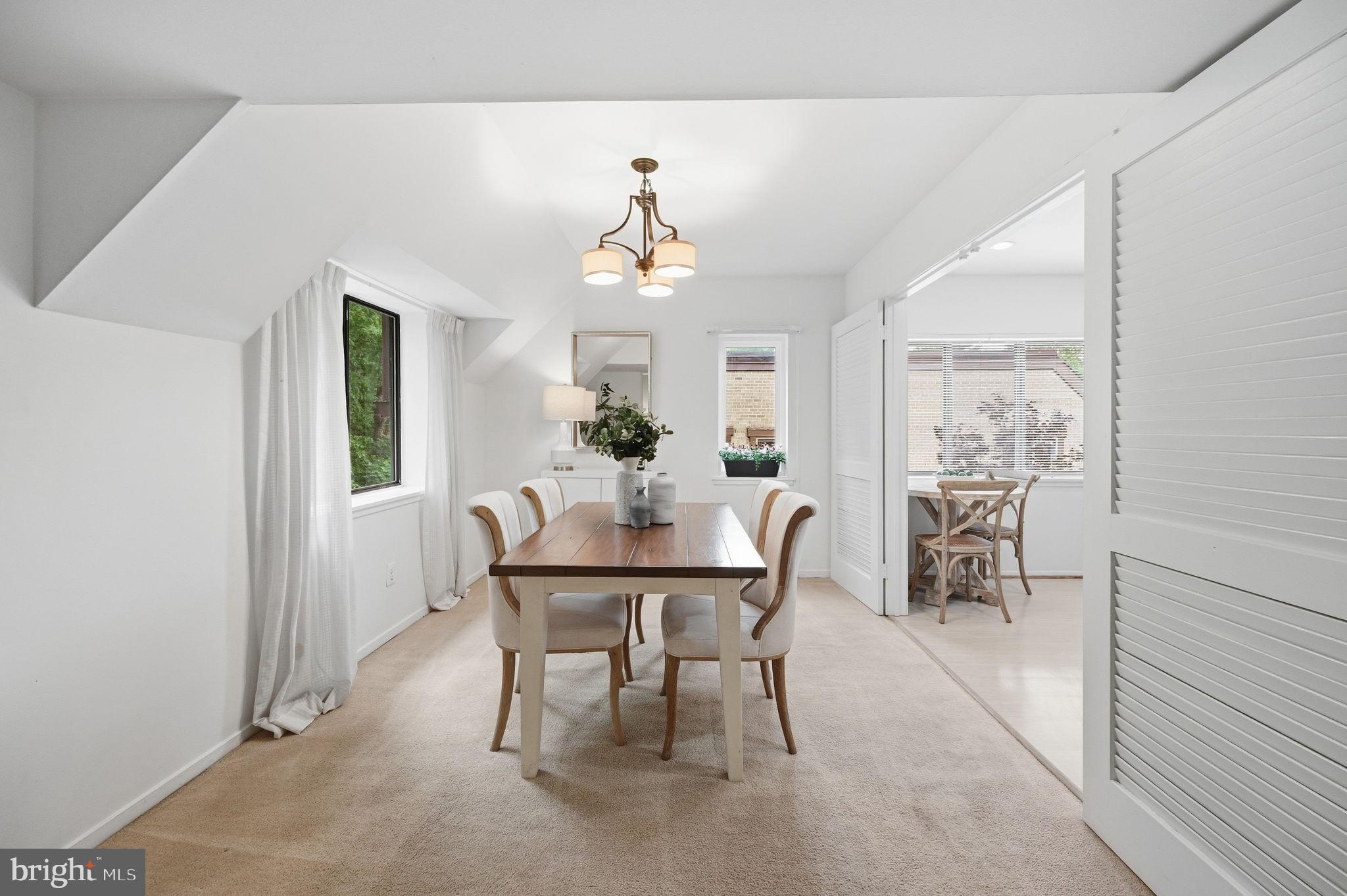 1659 Parkcrest Circle, Unit C Reston, VA 20190 - Photo 16 of 31 a view of a dining room with furniture and a chandelier
