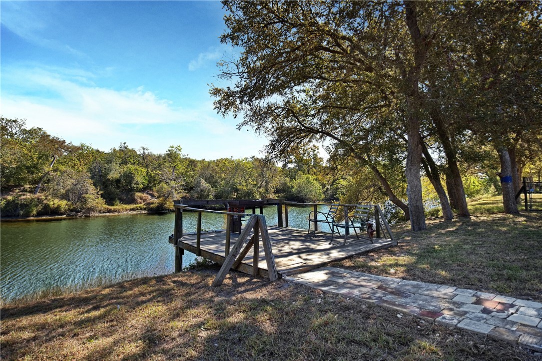 333 Mission River Oaks Road Woodsboro, TX 78393 - Photo 2 of 26 a view of a lake with a tree